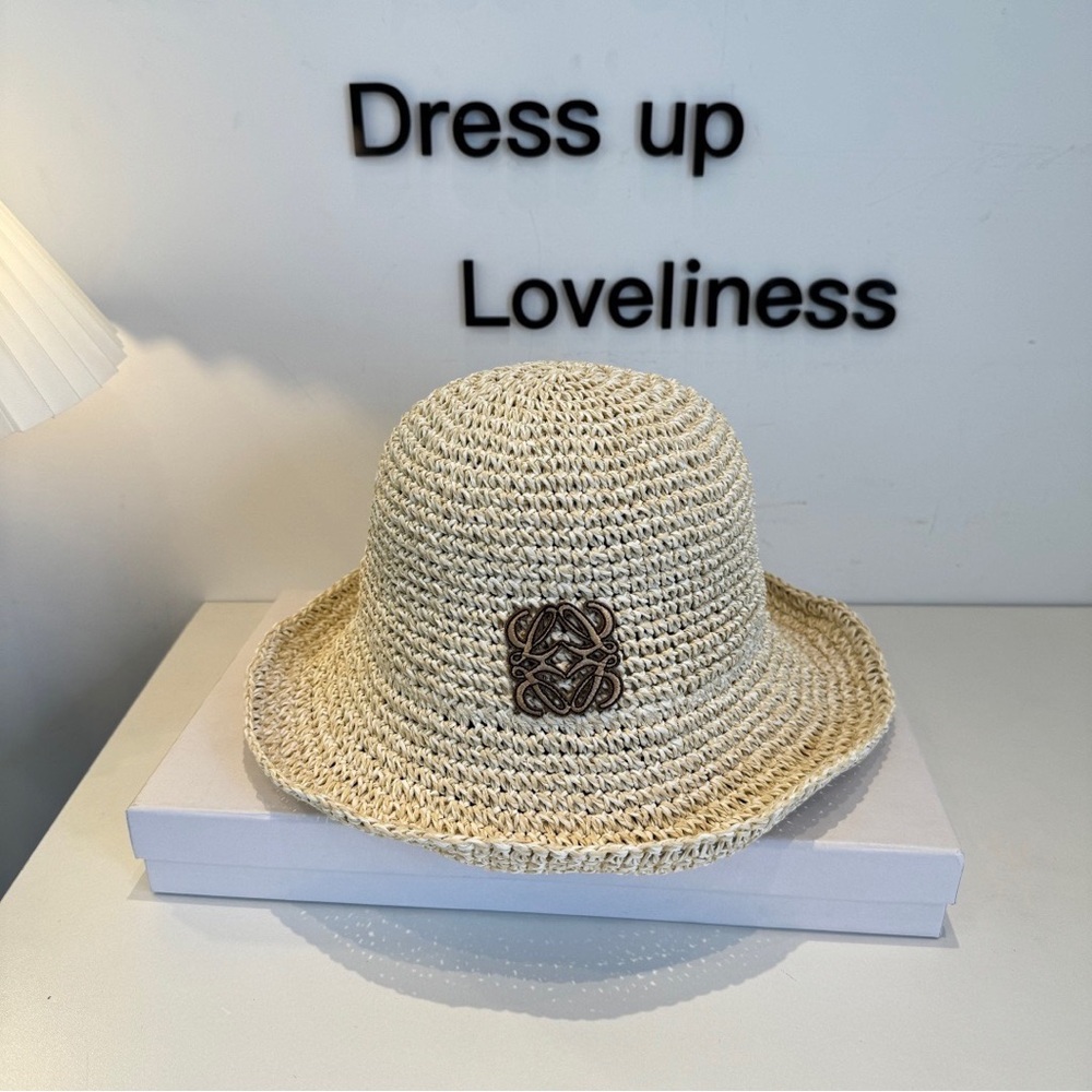Loewe Hats Crochet Straw Bucket Hat in Natural Beige with Decorative Emblem